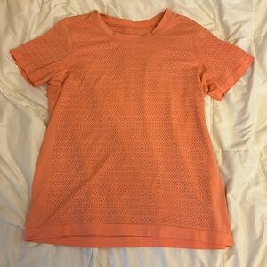 Salmon colored lululemon shirt